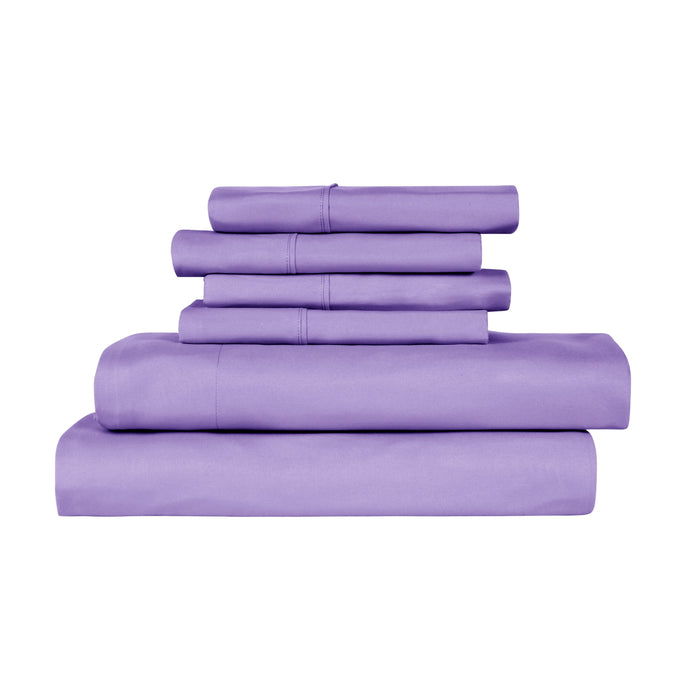 Set of purple bed sheets and pillowcases on a white background