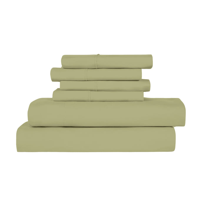 Stack of green bed sheets on a white background