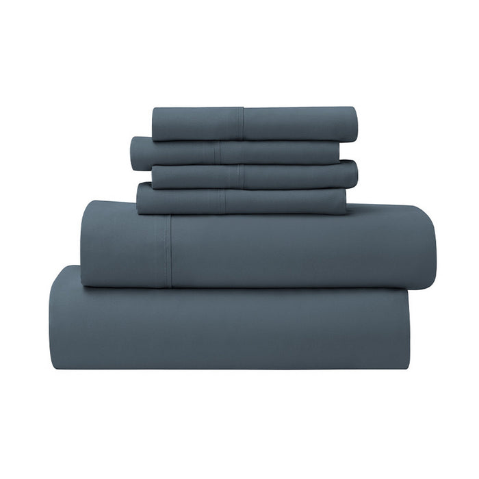 Set of blue bedding sheets stacked on a white background