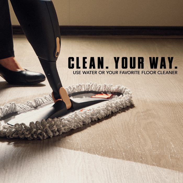 Person using a floor cleaning device on a wooden floor with text 'Clean. Your Way.'