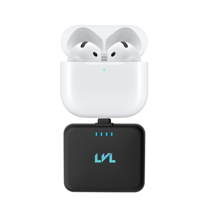 Wireless earbuds in a charging case with a black adapter on a white background